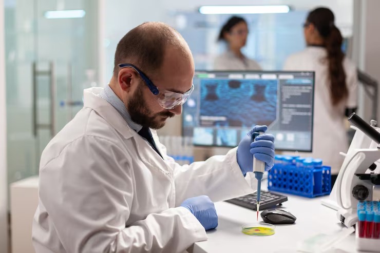Medical laboratory professional reviewing genetic testing samples and diagnostic results.